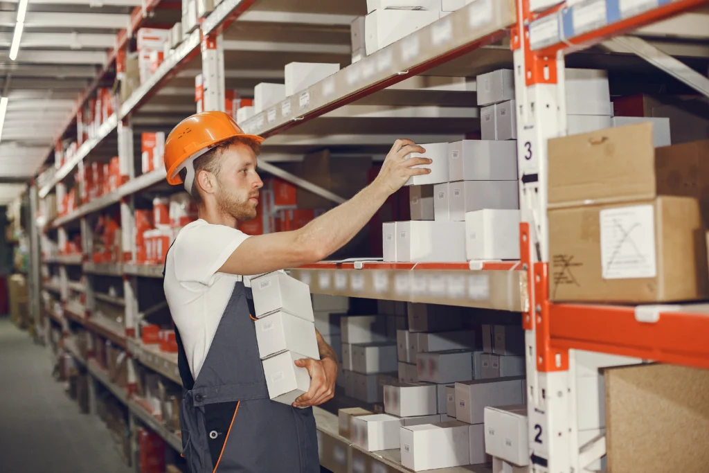 industrial worker indoors factory young technician with orange hard hat