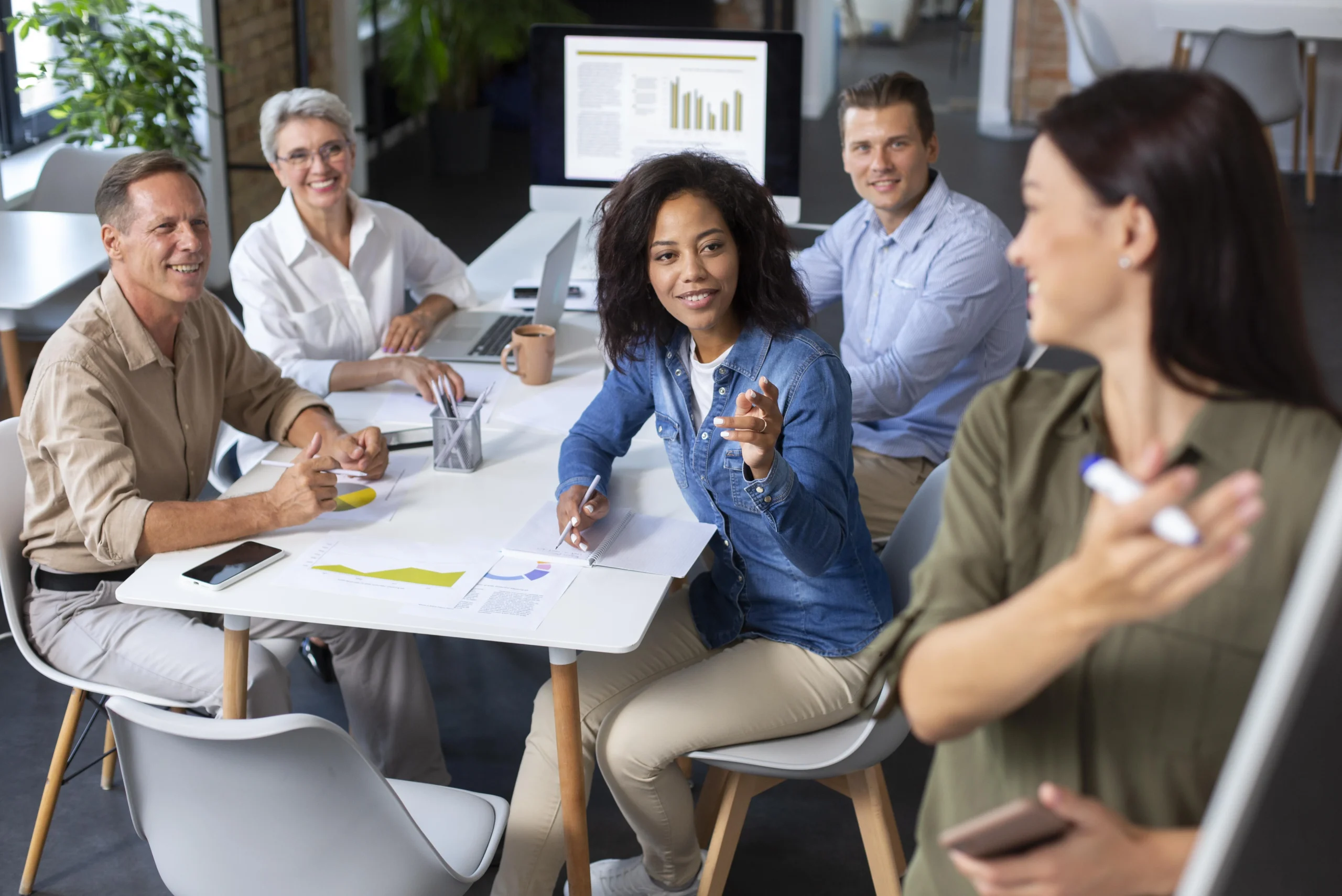 people using digital device while meeting