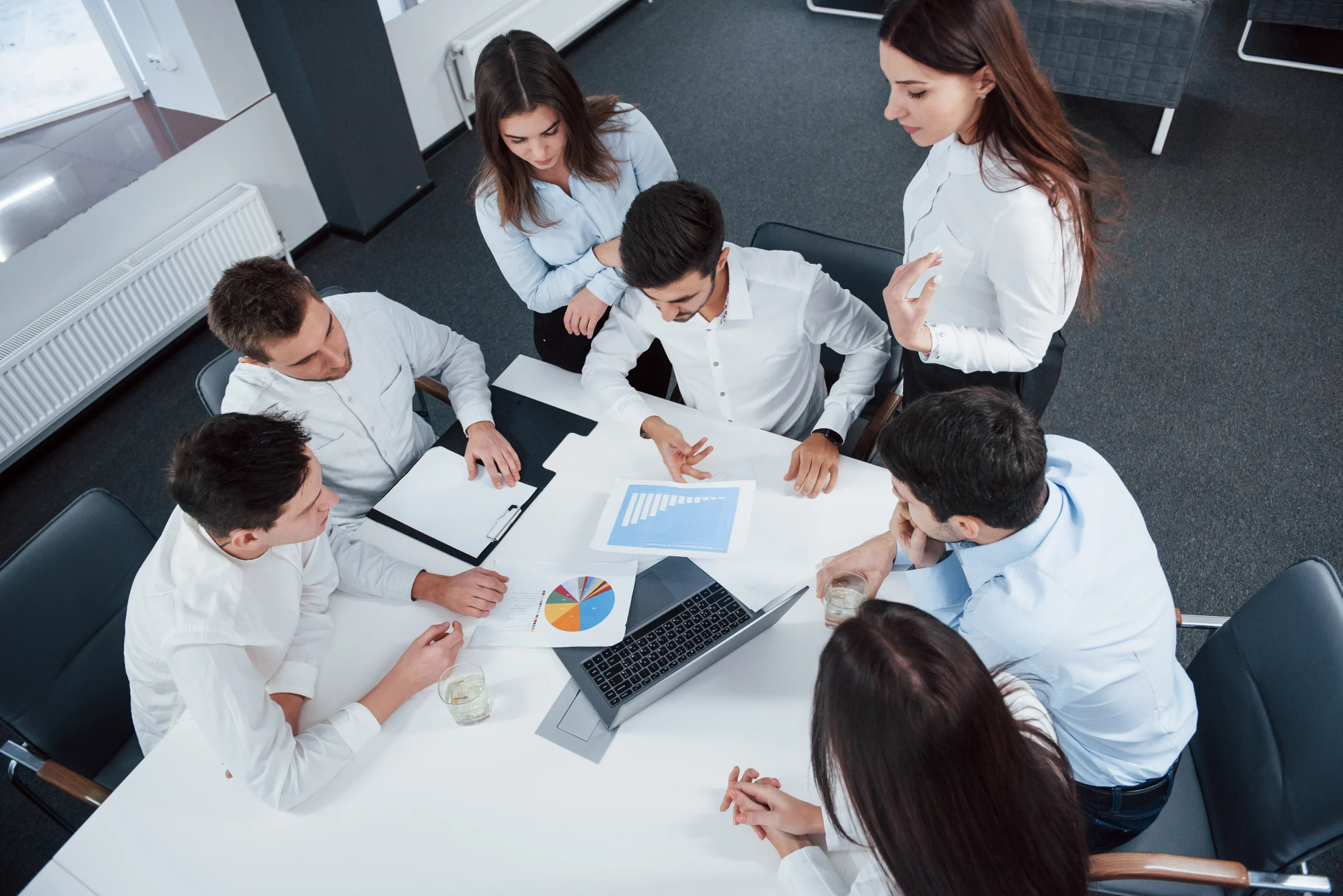 top view office workers classic wear sitting near table using laptop documents